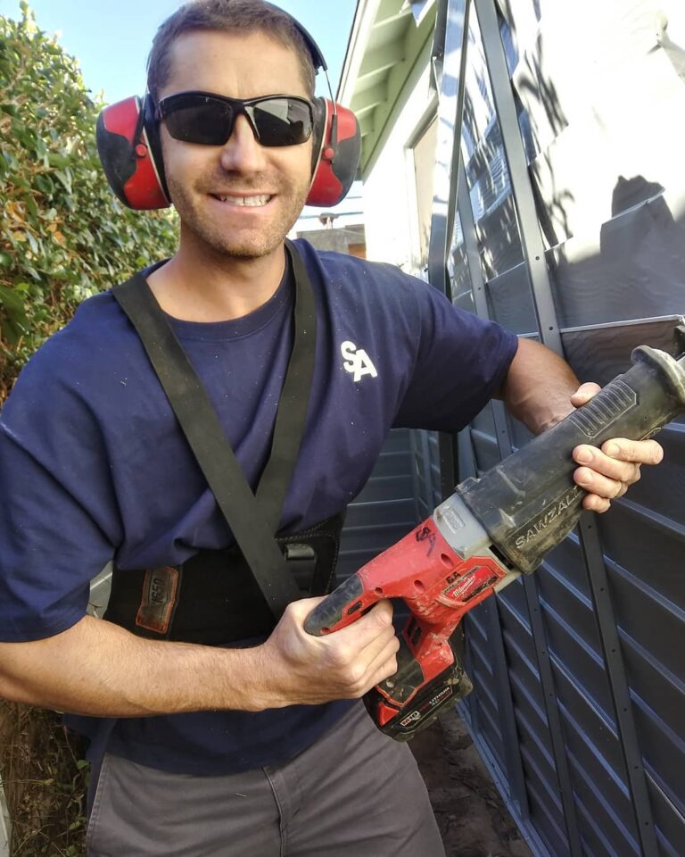 SA Junk Haul team member cutting up a hot tub during removal in San Marcos CA