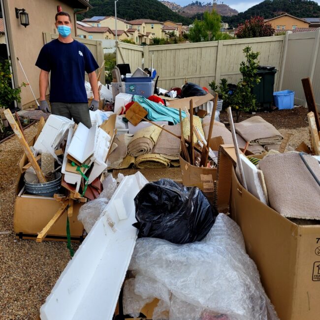 Residential junk removal in Escondido with household debris, furniture, and unwanted items ready for pickup